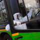 A driver wearing a protective suit climbs a bus used for transporting suspected carriers of coronavirus to a quarantine facility amid concerns about the spread of coronavirus disease (COVID-19), in Nizamuddin area of New Delhi, India, March 30, 2020. REUTERS/Danish Siddiqui